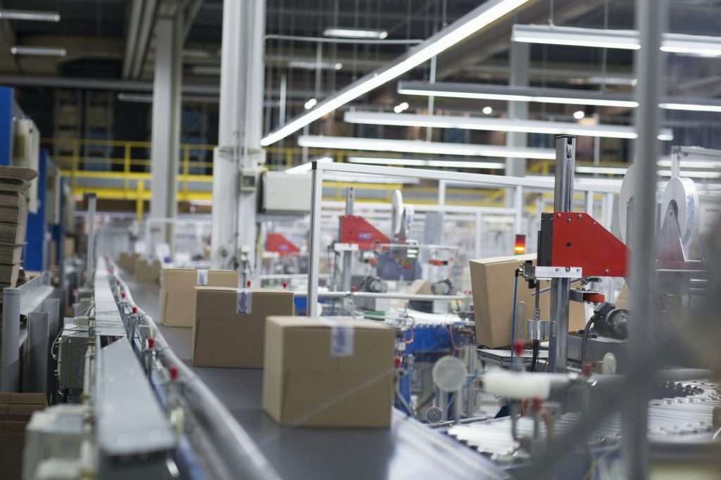 Boxes on production line at paper packaging factory